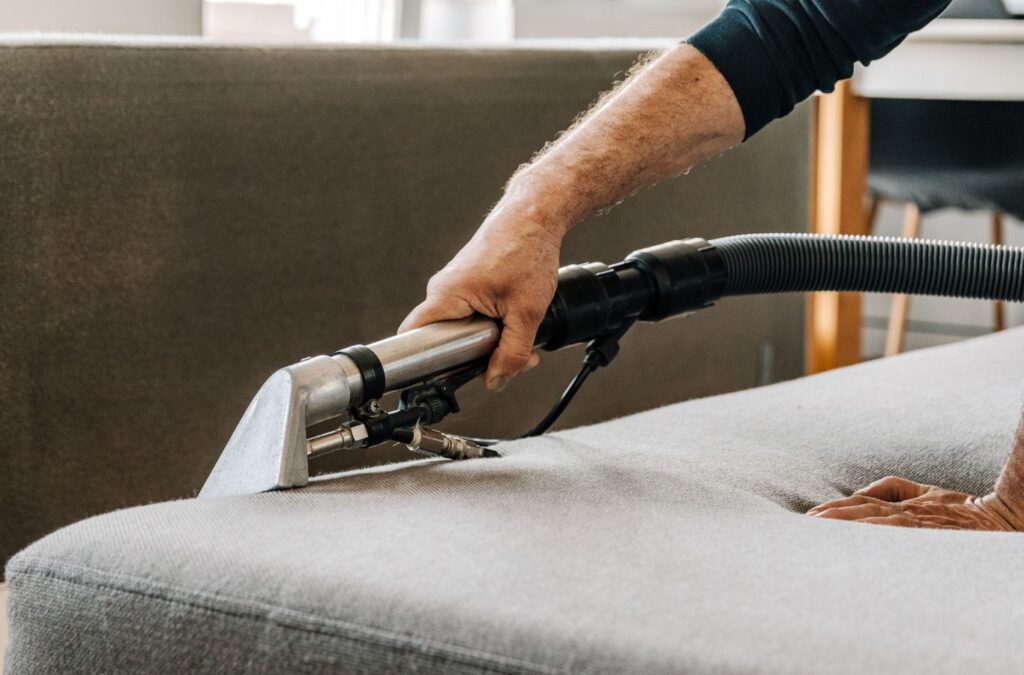 An experienced cleaner from The Sunshine Cleaners using eco-friendly products for deep cleaning in a New Tampa, FL home.